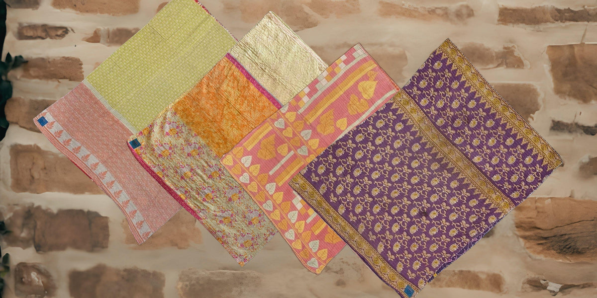 kantha quilts with a brick background